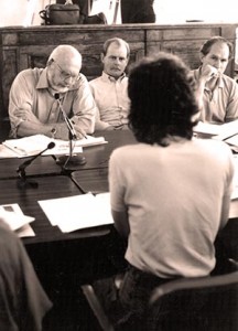 Cordova resident Riki Ott  (facing away from camera) speaks during a board meeting in September 1991. Board members pictured (left to right): Stan Stephens, Tim Robertson, and Bill Walker.