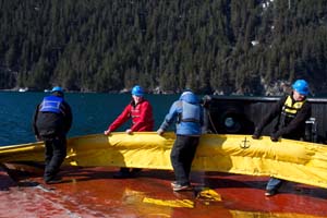 Participants help recover boom during this year's training in Seward. Photo by Jeremy Robida.