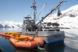 The buster, shown here during the Valdez training, has a collection area at the rear and a skimmer can be set inside to recover oil and oily water. Photo by Jeremy Robida.