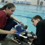Valdez students make adjustments to a remotely operated vehicle they designed and built during a recent program by the Prince William Sound Science Center.  The students used the vehicles to respond to a mock oil spill.  Photo by Kara Johnson.